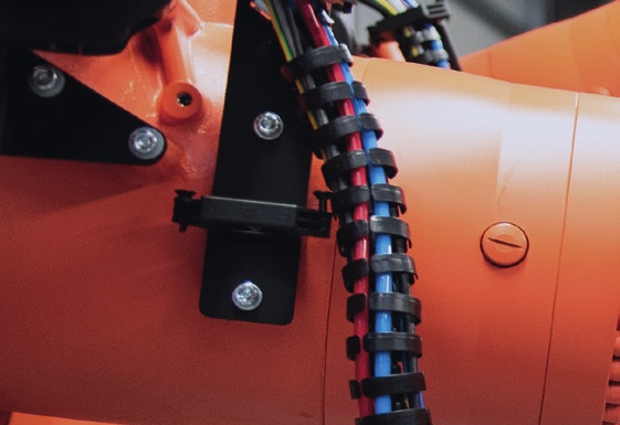 Detail of an industrial robot in an automated ultrasonic welding cell
